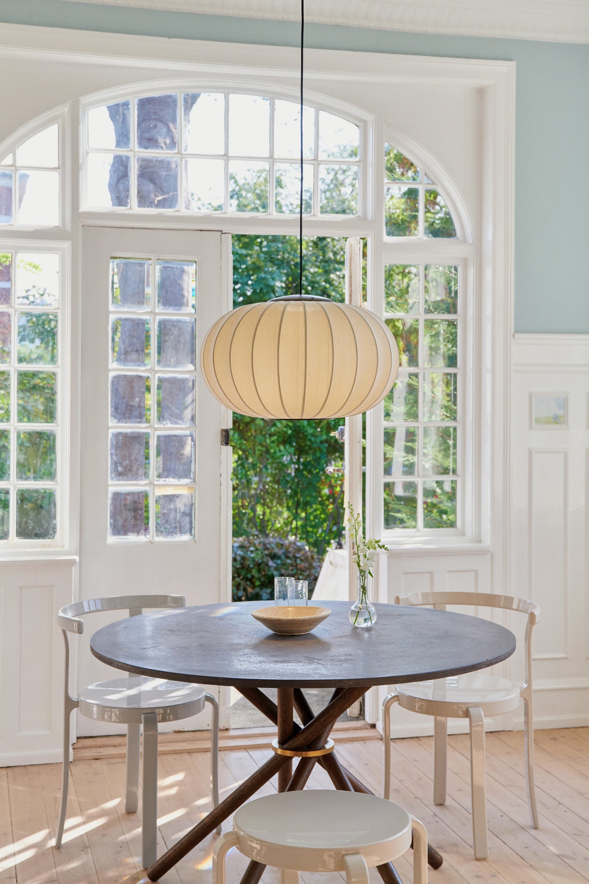 Knit-Wit Oval 57 LED Pendant in pearl white, shown in an interior (56)