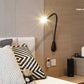 Sleek brown leather Cobra wall-mounted lamp, showcasing its compact design and built-in USB outlet.
