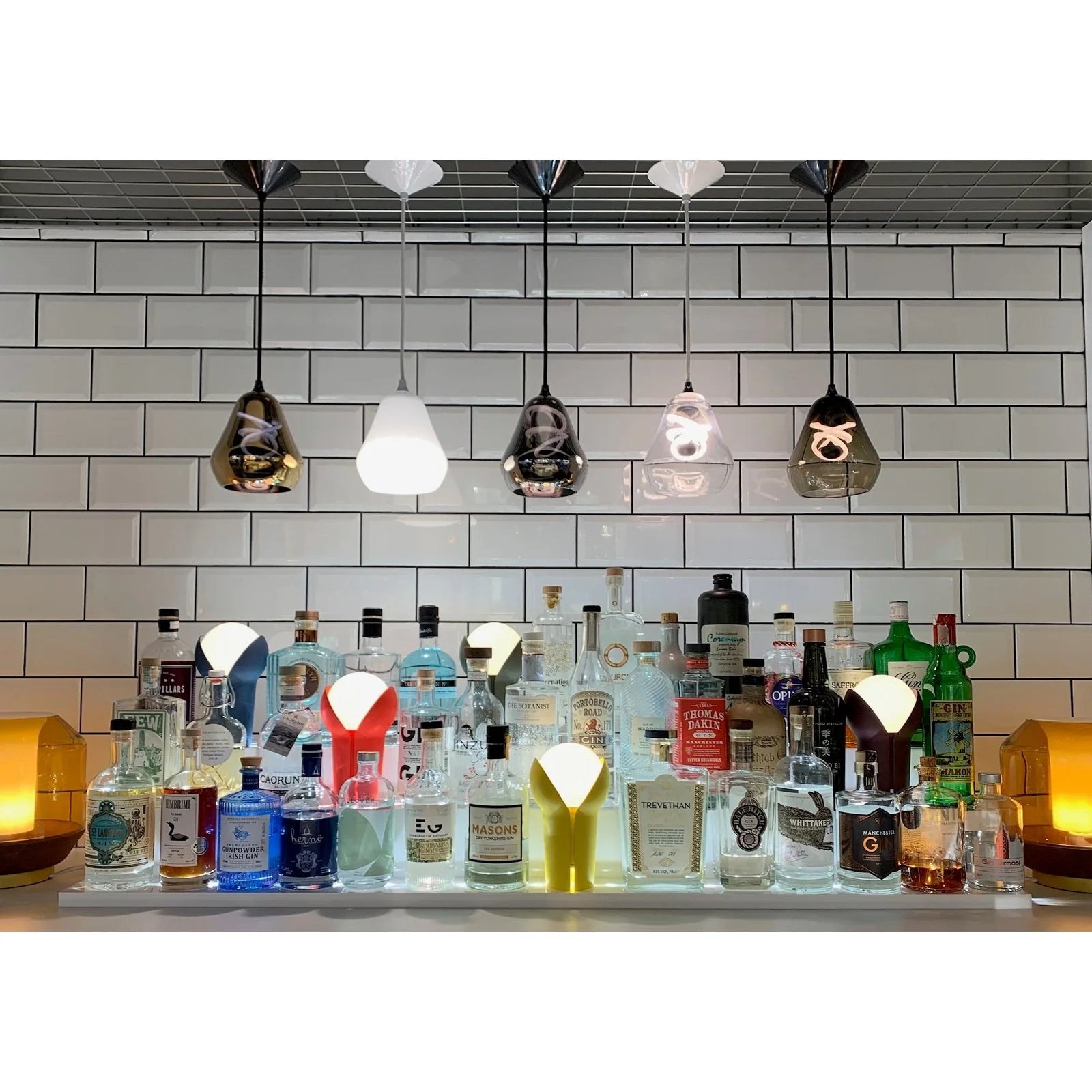 Minimalist frosted globe bulb inside Innermost Core glass pendant.