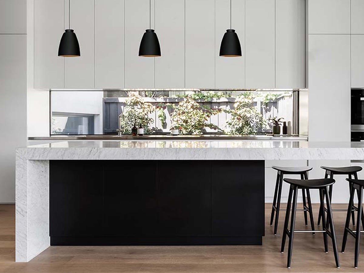 Innermost Chelsea pendant light by James Bartlett – Black and Gold over a kitchen counter