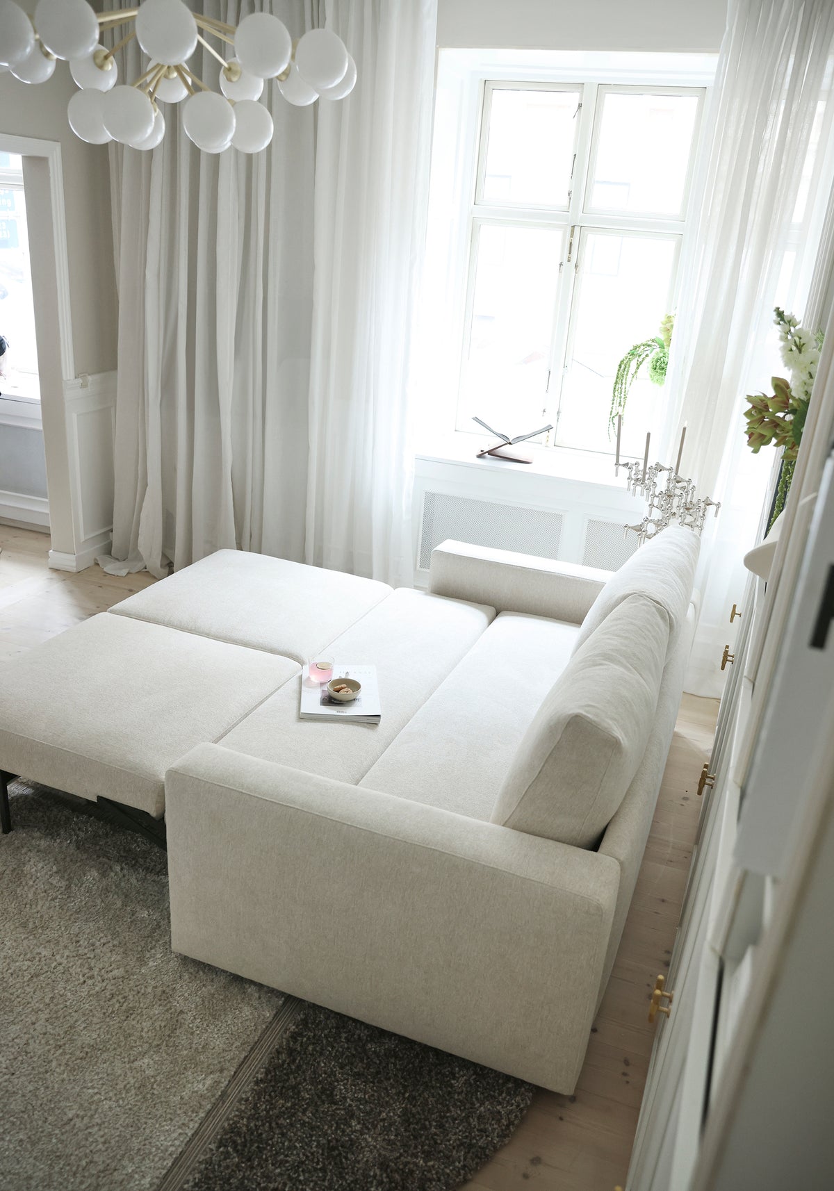 Innovation Living Neah Queen Sofa Bed with Standard Arms in a furnished room, Halifax Shell fabric – view 11