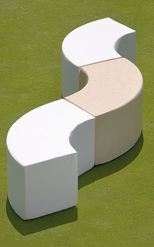 Three white Arc modules arranged in an S-curve on a green lawn