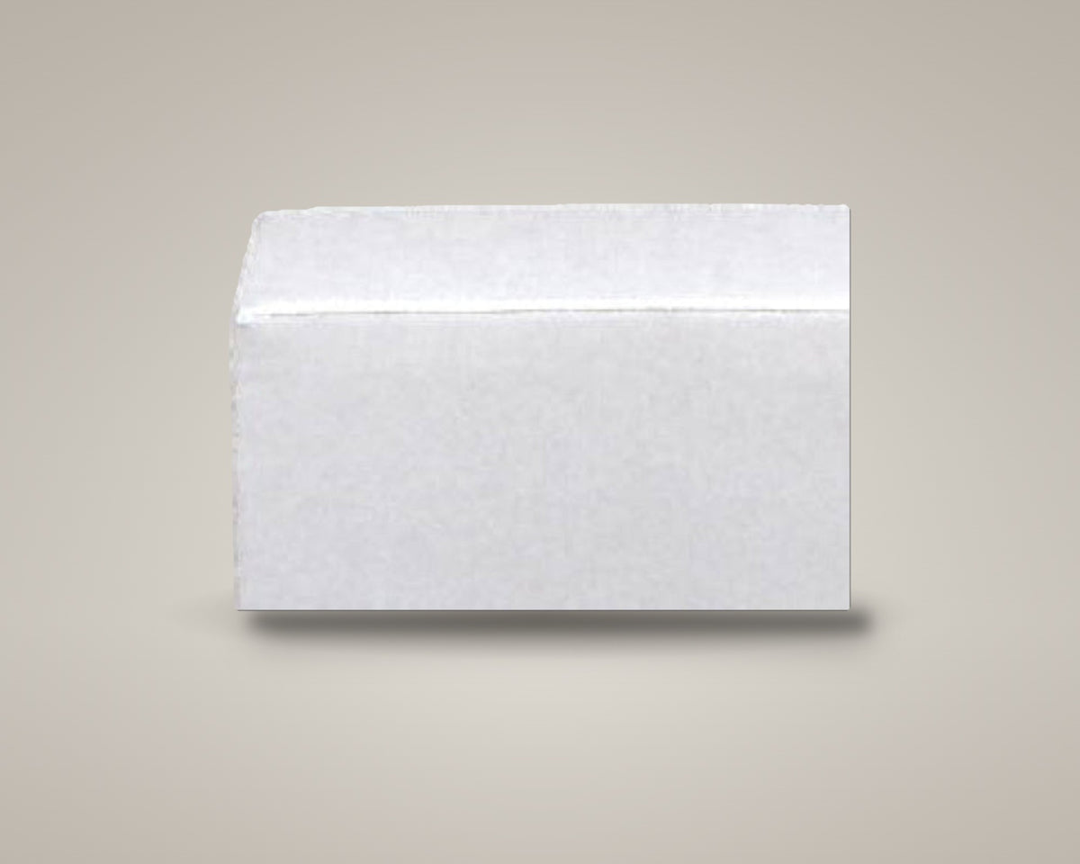 Zinc square ottoman in white vinyl on a soft warm-grey studio backdrop with a floor shadow, angled view