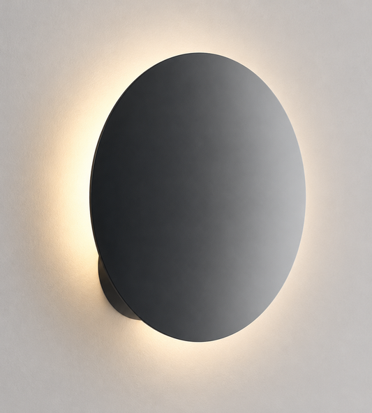 Modern Lodes Puzzle Round Single wall light in matte black featuring a sleek circular profile and contemporary LED design