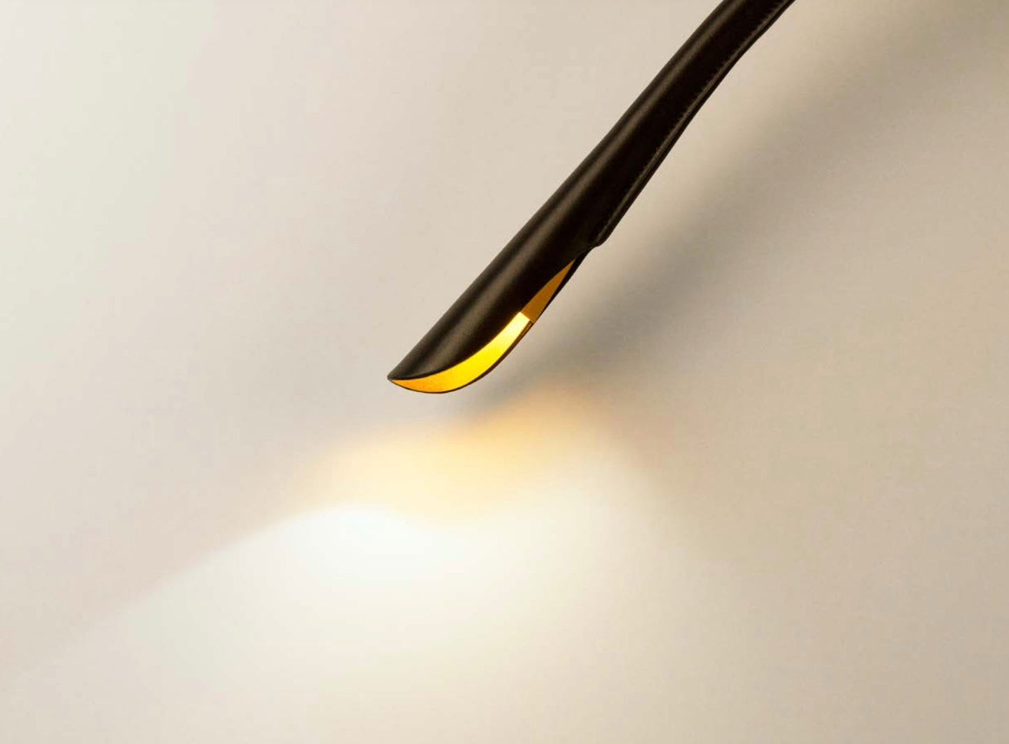 Luxury brown leather Cobra bedside lamp with touch dimmer switch and gold anodised inner reflector.