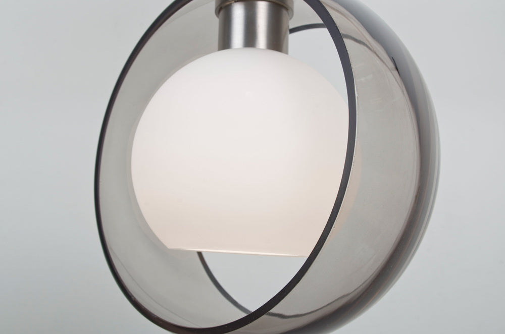 Besa Mana glass, close view: opal globe inside a transparent outer ring
