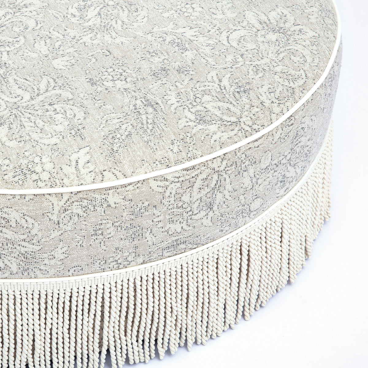 Tassy Neutral Floral Tasseled Round Ottoman by TOV Furniture – photo 4 of 6