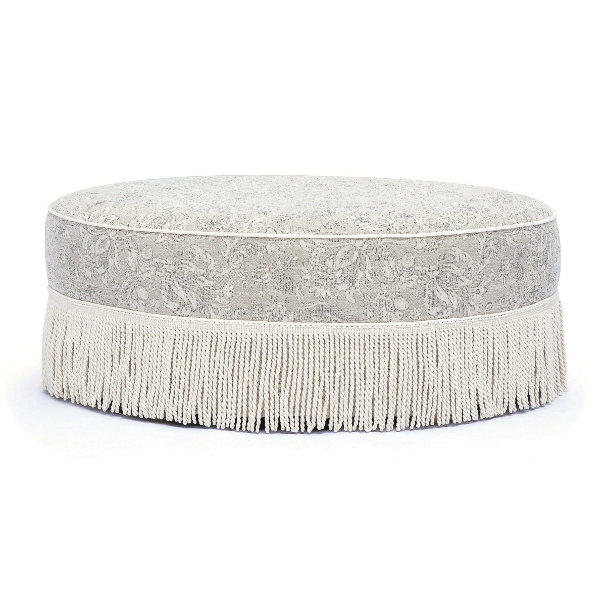 Tassy Neutral Floral Tasseled Round Ottoman by TOV Furniture – photo 1 of 6