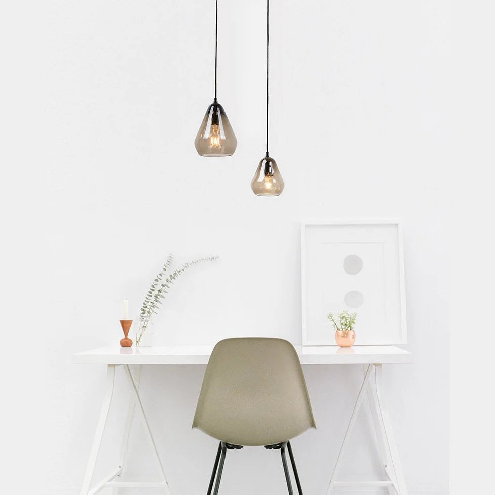 Ambient smoked glass ceiling light creating a cozy bedroom atmosphere.