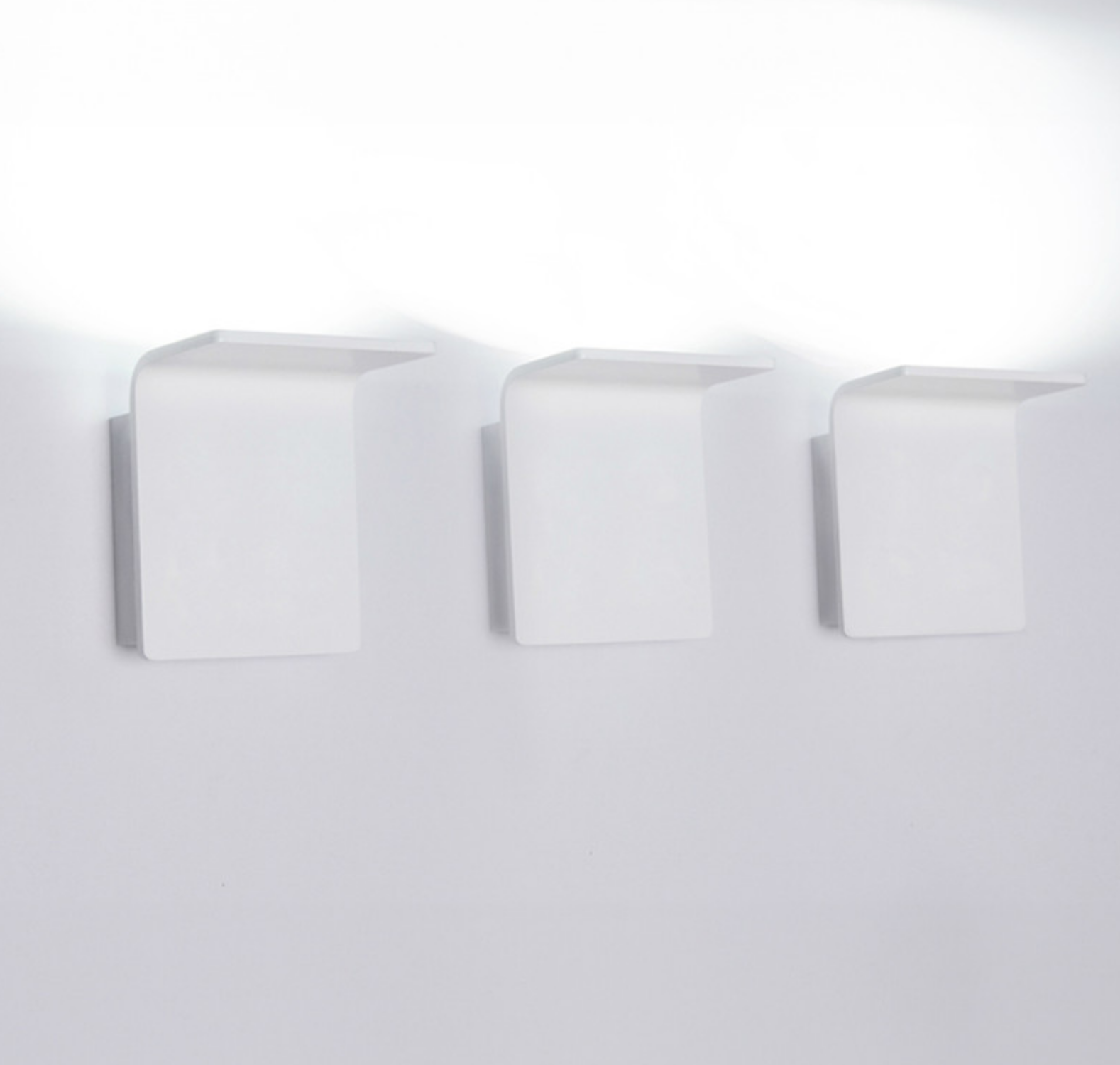 Modern white LED uplight/downlight fixture, Innermost Bracket series WB0883-01, perfect for illuminating hallways, bedrooms, or contemporary entryways.