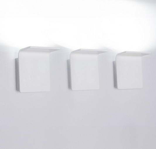 Modern white LED uplight/downlight fixture, Innermost Bracket series WB0883-01, perfect for illuminating hallways, bedrooms, or contemporary entryways.