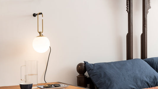 Artemide NH Wall Light in a room setting