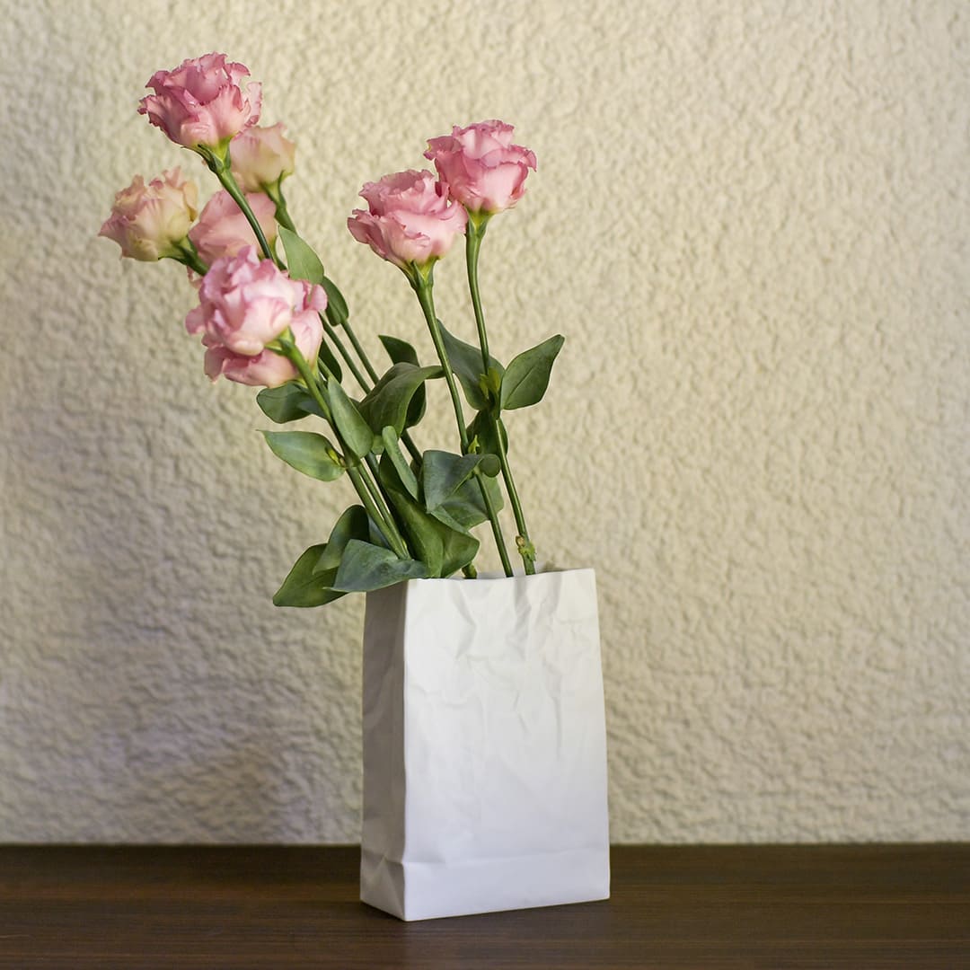 Ceramic Japan Crinkle Paper Bag Vase, White Porcelain – with pink roses on a table