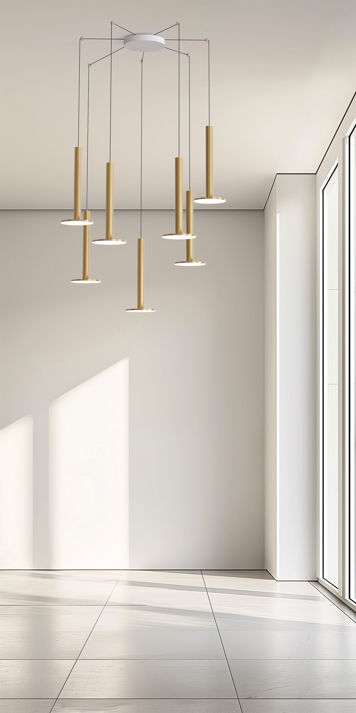 Pablo Designs Cielo XL 7-light multi-pendant in brass, hanging in a bright white room