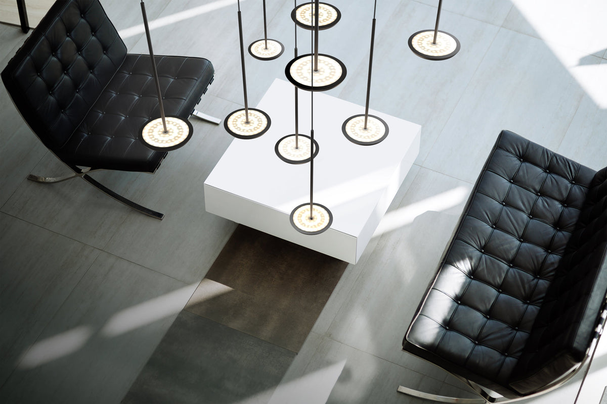 Pablo Designs Sky Solo Chandelier 13 shown in a furnished interior