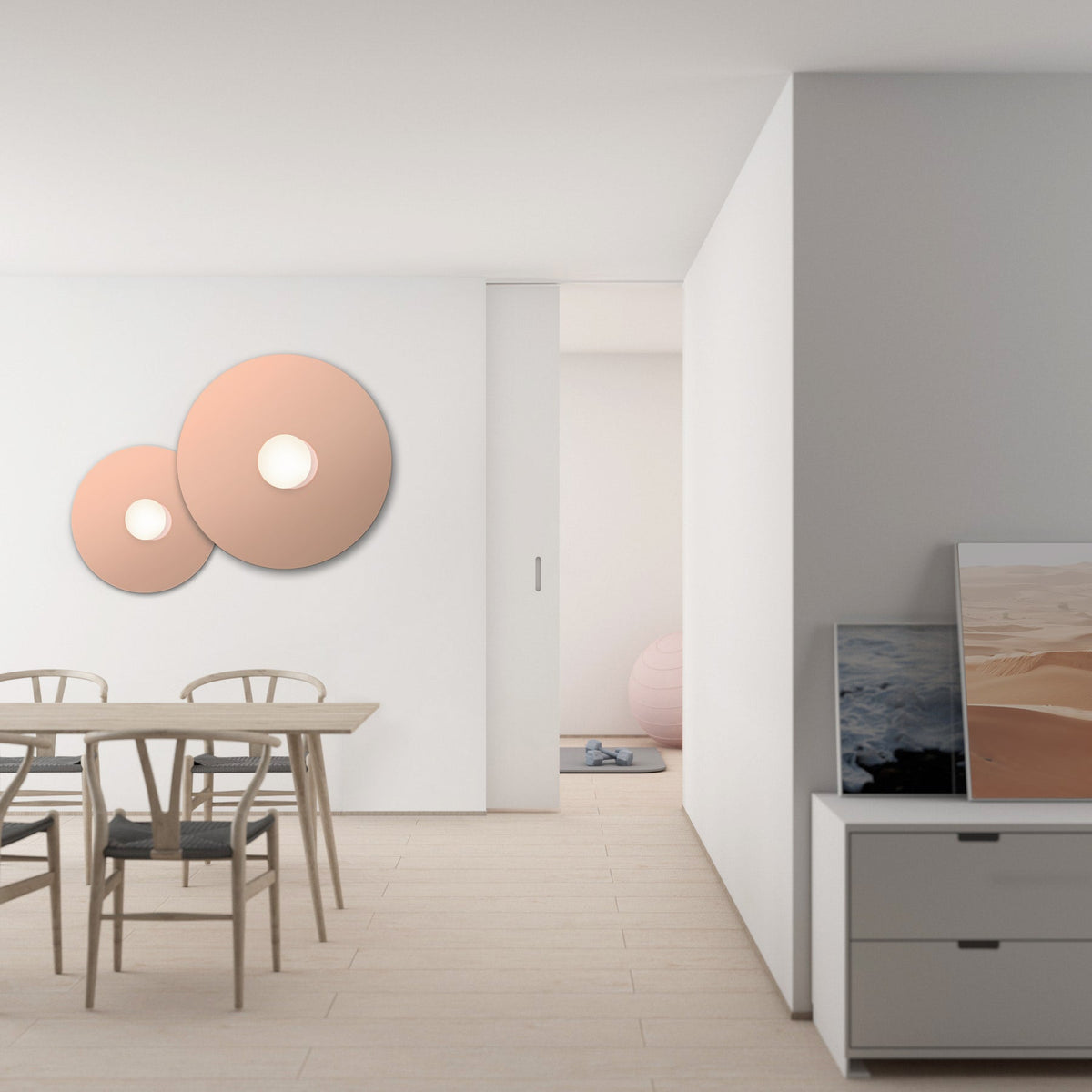 Bola Disc Colors flush mount discs glowing on a wall in a furnished room