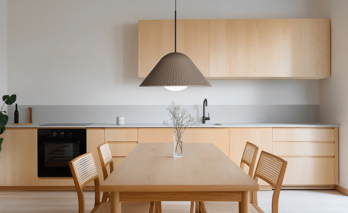 Pablo Designs Bola Bell LED Pendant shown in a furnished interior