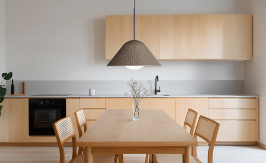 Pablo Designs Bola Bell LED Pendant shown in a furnished interior