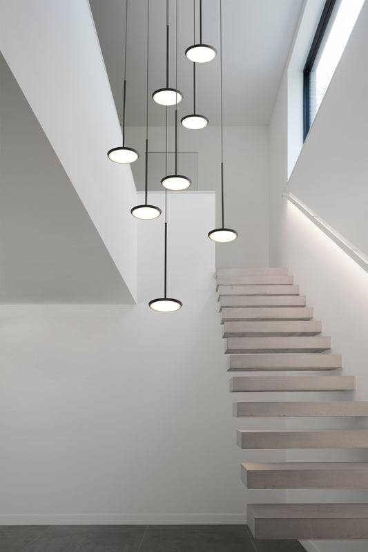 Pablo Designs Sky Solo Chandelier 3 shown in a furnished interior