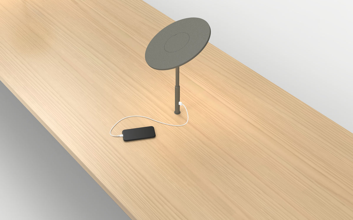 Pablo Designs Circa Grommet LED Desk Lamp shown in a furnished interior