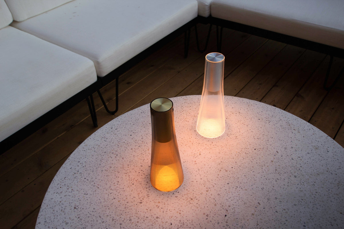 Pablo Designs Candél salt and pepper pair glowing on a table