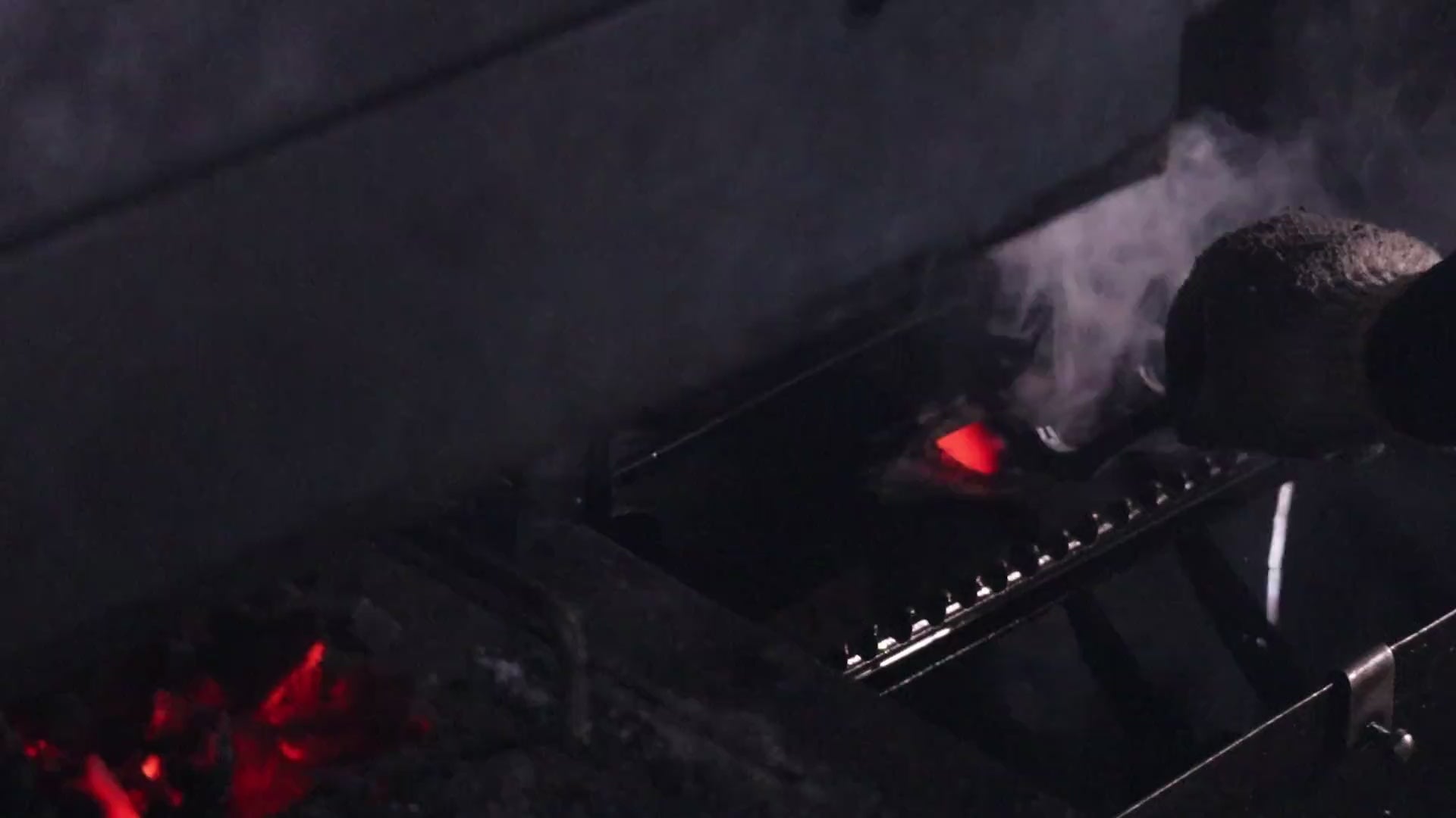 Tobisho forge close-up – steel heated in the charcoal fire before hammering