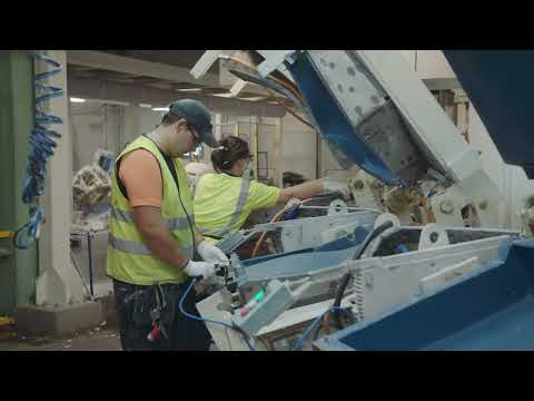 Conform Sweden luxury recliner with black leather cushioning and walnut base