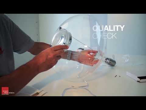 Video showing the Lodes Sky-Fall Round LED pendant with a clear hand-blown glass globe illuminated from multiple angles