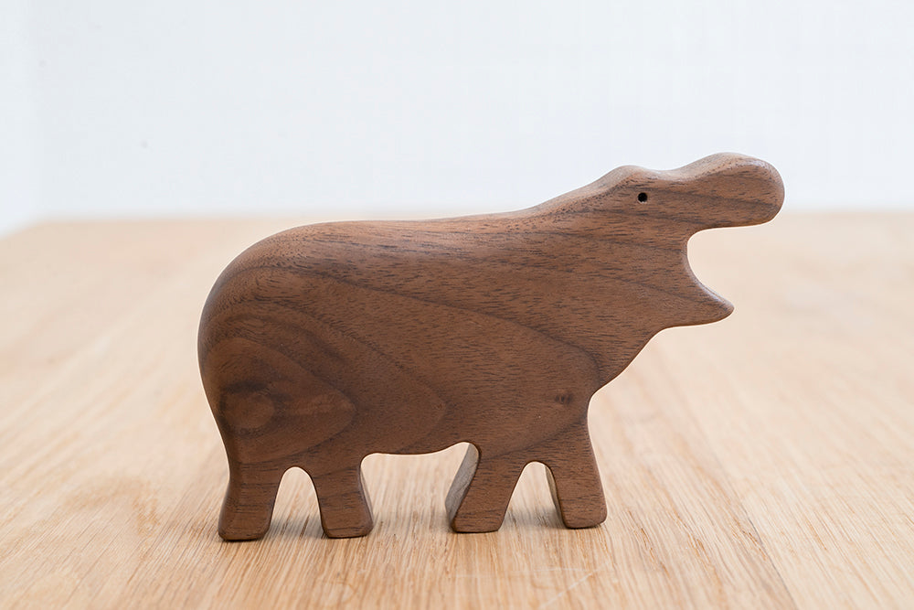 Eguchi Toys Hippo Rattle – on a wooden table