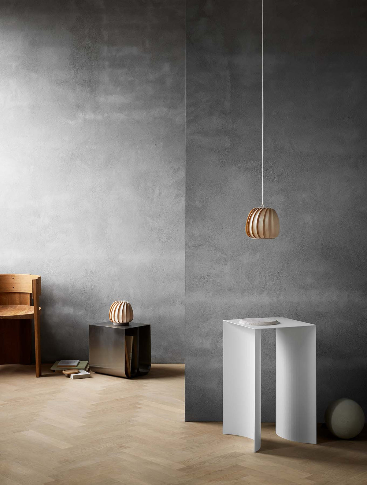 Tom Rossau ST906 Mini pendant light – Natural Birch over a table, unlit