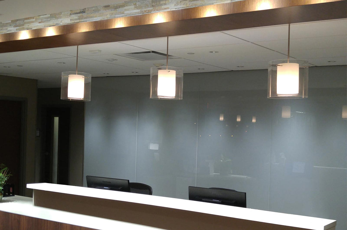 Besa Pahu 12 detail: pahu stem pendants over a front desk