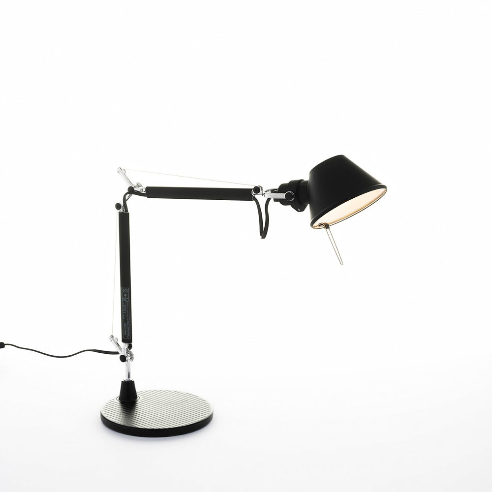 Tolomeo Micro by Artemide in black with articulated arms and circular table base