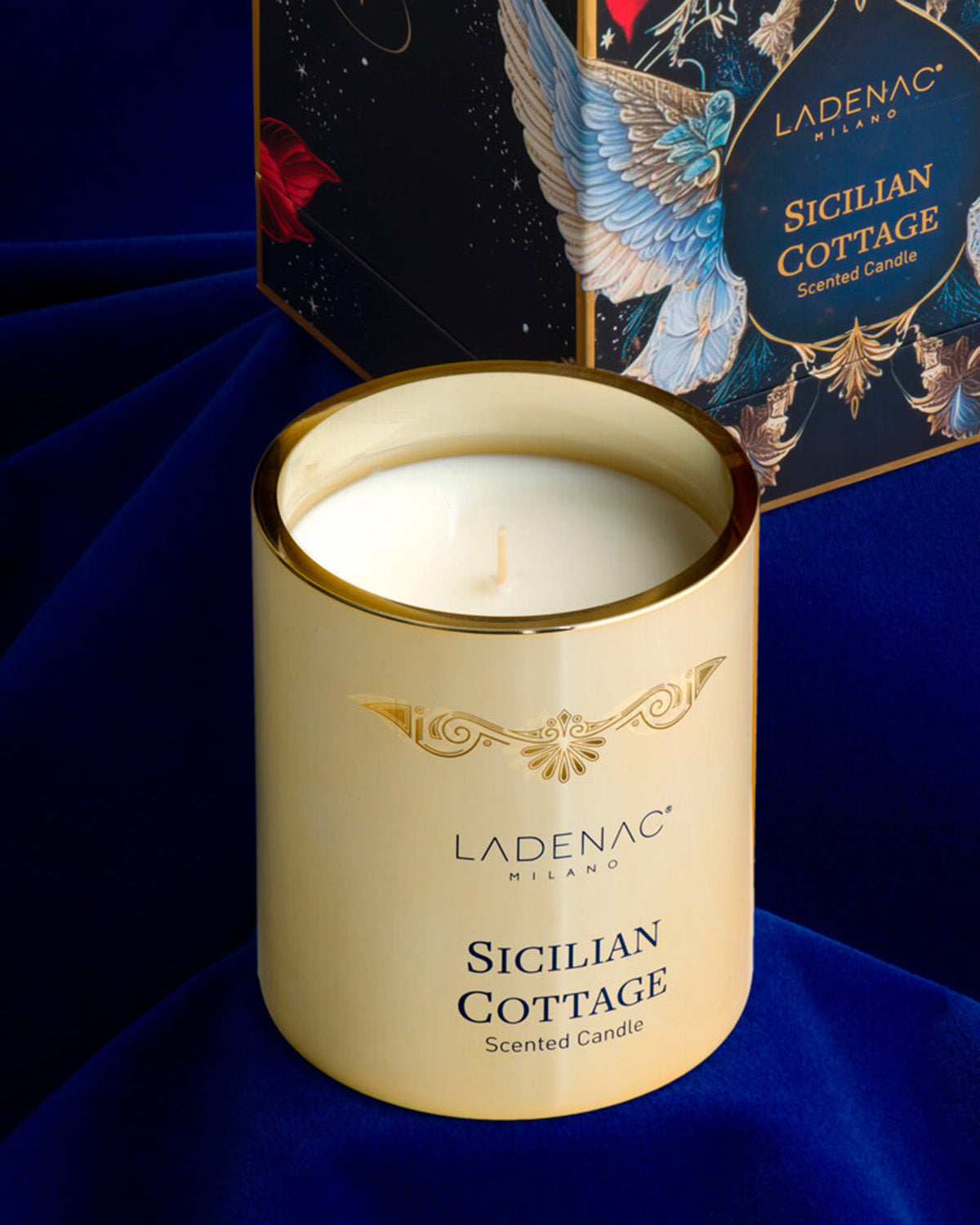 Sicilian Cottage 330 g scented candle by Ladenac Milano, candle styled against a deep blue backdrop