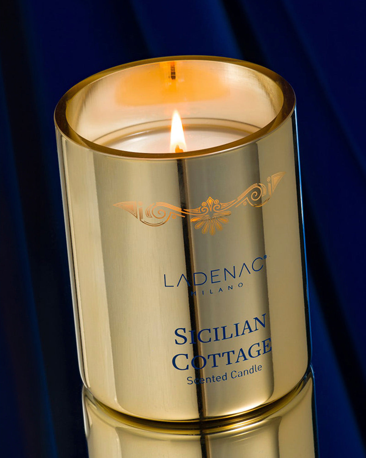Sicilian Cottage 330 g scented candle by Ladenac Milano, lit candle styled at night