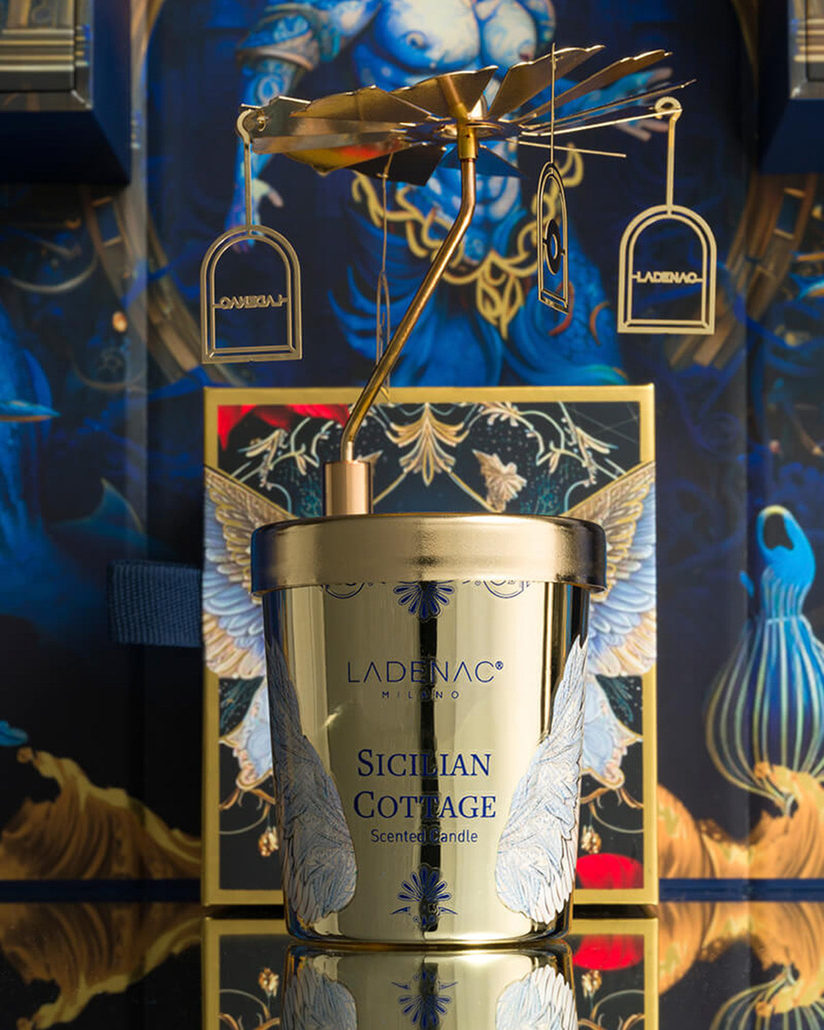 Sicilian Cottage 75 g carousel candle by Ladenac Milano, candle styled against a deep blue backdrop