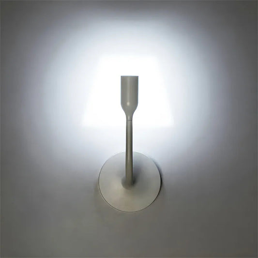 Innermost YOY LED wall light by YOY – lit on a living room wall