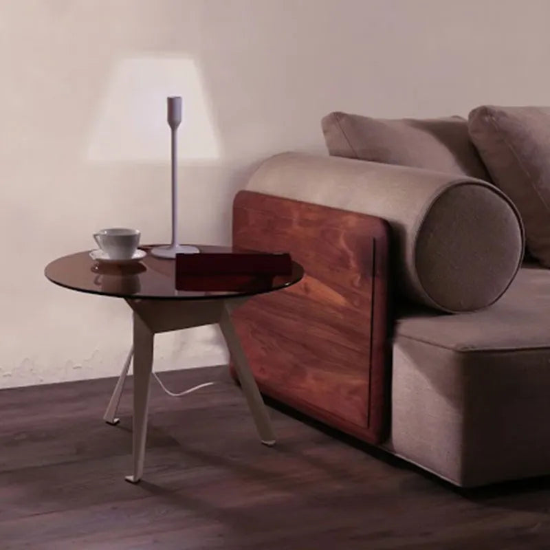 Innovative Yoy lamp illuminating a bedroom nightstand, creating a virtual lampshade silhouette for ambient light.