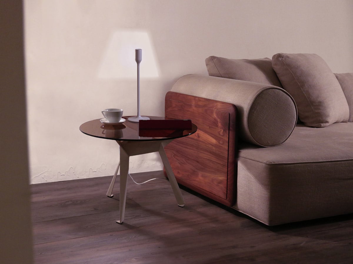 Innermost YOY LED table lamp by YOY – beside a sofa